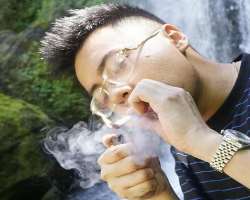 Erick Khan smoking